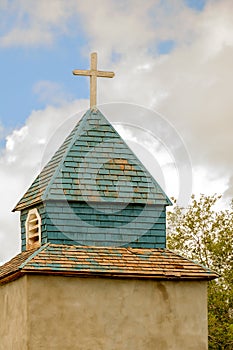 Cross and steeple on an old church