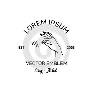 Cross Stitch Logo. Vector Emblem Embroidery. Illustration of Female Hand Holding Needle photo