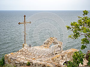 Cross on a stone church at Kaliakra. Kaliakra is a cape in the Southern Dobruja region of the northern Bulgarian Black Sea Coast photo