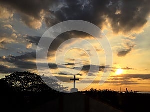 Cross with sun set background