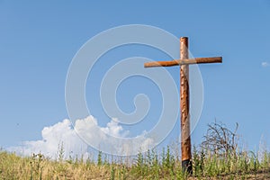 Cross in the sunlight with a blue sky
