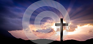 Cross at sunset. Christian background photo