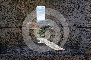 Cross to observe in the wall of the castle