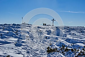 Cross on top of Pilsko mountain in winter in Beskidy mountains