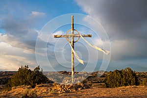 Cross under dramatic sky on the Easter pilgrimage route to Chimayo, New Mexico photo