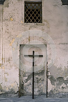 Cross on wall background, symbol of Christianity