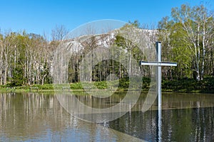 Cross on the water with an inverted reflection