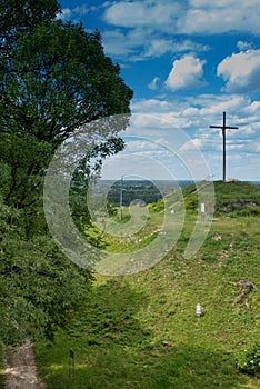 The cross on the way of the cross in a park next to the shrine o