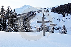 Cross at the Winter Mountain Peak at the Austrian Alps, in Lech am Arlberg