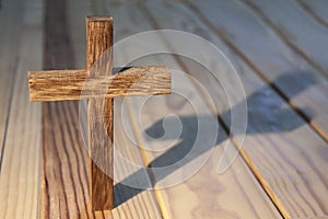 Cross on wood table