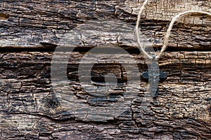 Cross on a wooden background close-up and space for text