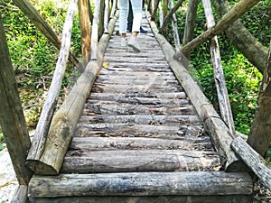 Cross a wooden bridge