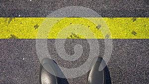 Cross the yellow line ? A person in front of the line. Concept illustration showing shoes in front of a yellow line. 3D Rend