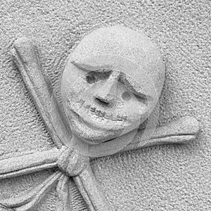 Crossbones carved in a tombstone