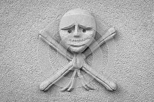 Crossbones carved in a tombstone