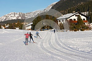 Crosscountry skiers on a track in Davos photo