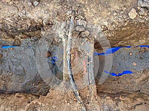 Crossection of water pipeline and electric lines or telecommunication cables photo