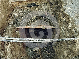 Crossection of water pipeline and electric lines or telecommunication cables photo