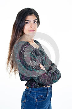 Crossed arms beautiful young woman pensive looking side posing against white background wall