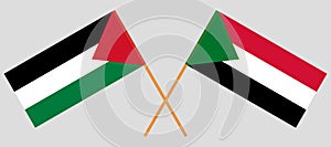 Crossed flags of Palestine and Sudan