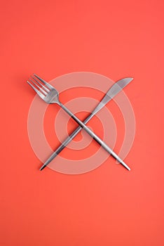 Crossed forks and a knife.