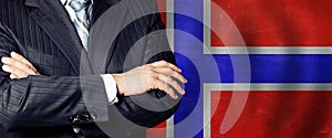 Crossed hands against Norwegian flag background, business, politics and education in Norway concept