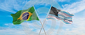 crossed national flags of Brazil and TransAmerica flag waving in the wind at cloudy sky. Symbolizing relationship, dialog,