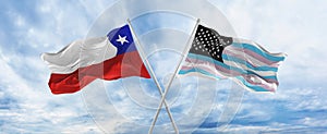 crossed national flags of Chile and TransAmerica flag waving in the wind at cloudy sky. Symbolizing relationship, dialog,