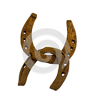 Crossed retro rusty two horseshoes on white