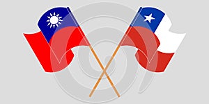 Crossed and waving flags of Chile and Taiwan