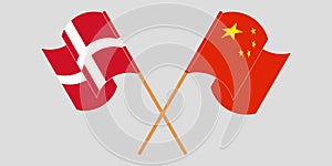 Crossed and waving flags of Denmark and China