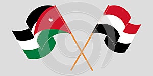 Crossed and waving flags of Jordan and Yemen photo