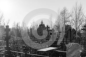 Crosses in a Christian cemetery on a sunny day. Everlasting memory. Black and white photo