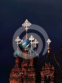 Crosses and domes glow before rain in Solba monastery.