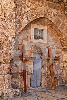 Crosses lean under an arch in the wall of the Church of the Holy Sepulcher in the Christian Quarter of the Old City of Jerusalem