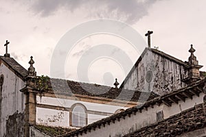 The crosses at the roof of some houses of the colonial city of Paraty, Brazil.