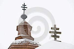 Crosses on top of Greek Catholic wooden church and belfry in Kalna Roztoka