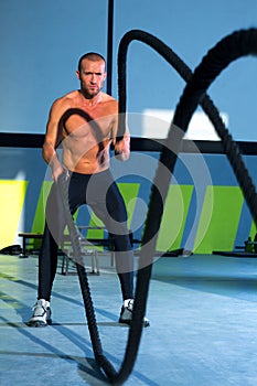 Crossfit battling ropes at gym workout exercise