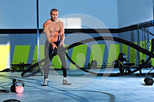 Crossfit battling ropes at gym workout exercise