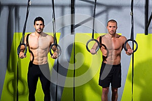 Crossfit dip ring two men workout at gym