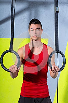 Crossfit dip ring young manman relaxed after workout