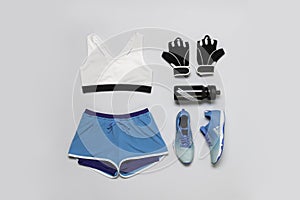 Crossfit sportwear outfit flatlay stilllife shot from above isolated on grey background