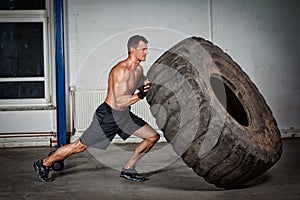 Crossfit training - man flipping tire