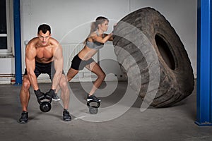 Crossfit training - woman flipping tire