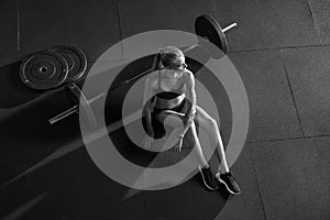 Crossfit woman sitting on floor