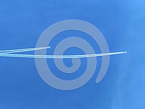 Crossing of airline lines on the blue sky