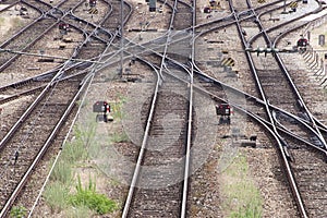 Crossing Railroad Tracks Near a Train Depot