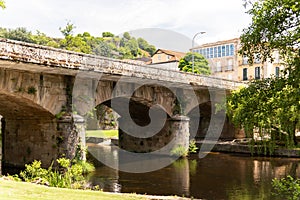 Crossing the serene waters of the Avia River, the historic stone bridge in Ribadavia, Galicia exudes rustic charm