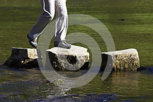 Crossing three stepping stones in a river