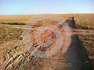 Crossroad in the steppe and blue sky